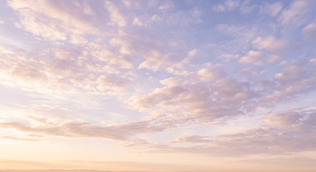 Pastel sky with soft clouds at sunrise